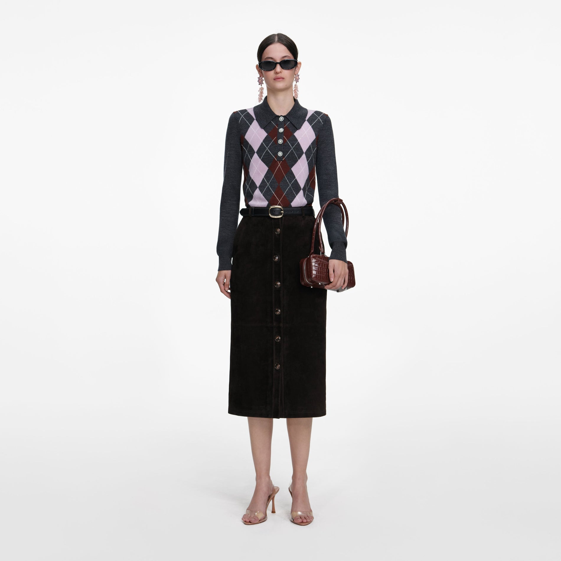 Front view of a woman wearing the Brown Suede Midi Skirt