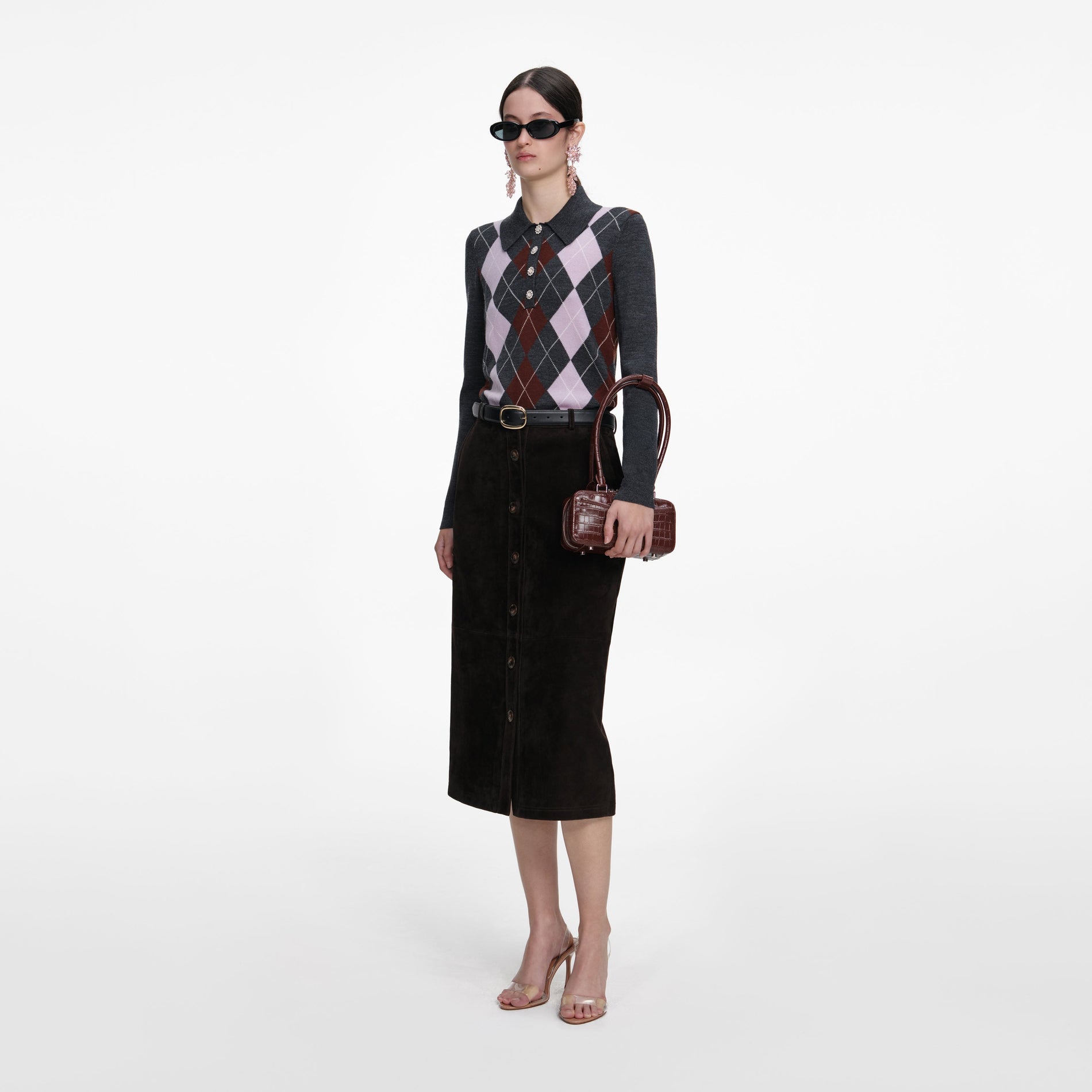 Side view of a woman wearing the Grey Argyle Lightweight Jumper