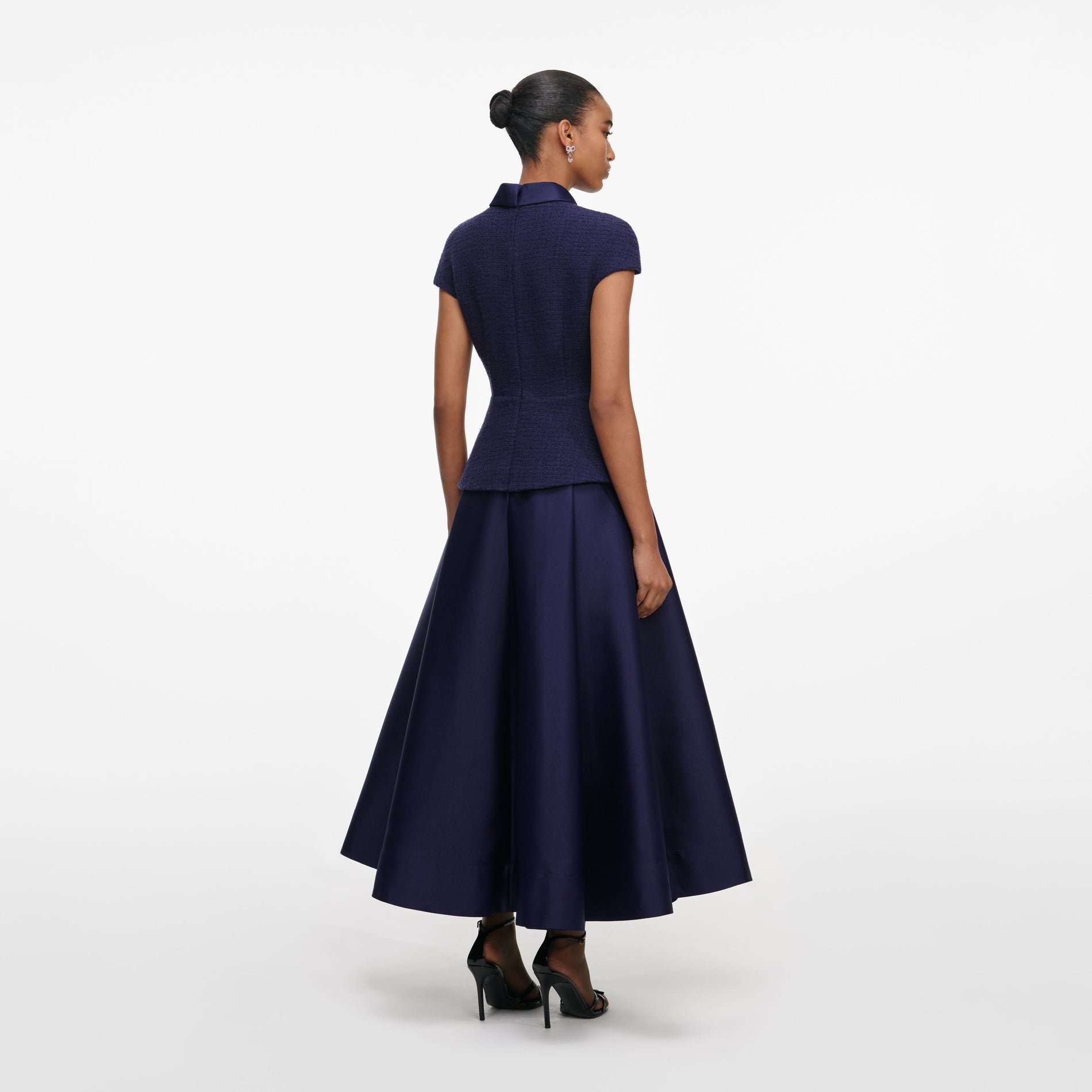 Back view of a woman wearing the Navy Boucle Taffeta Midi Dress