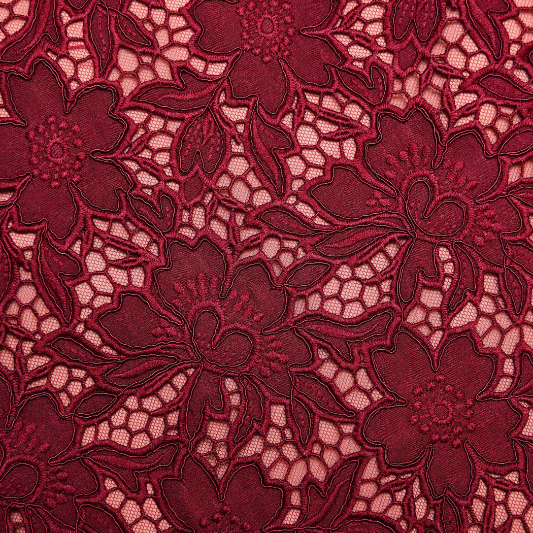 A close up of the fabric for the Burgundy Guipure Lace Midi Skirt