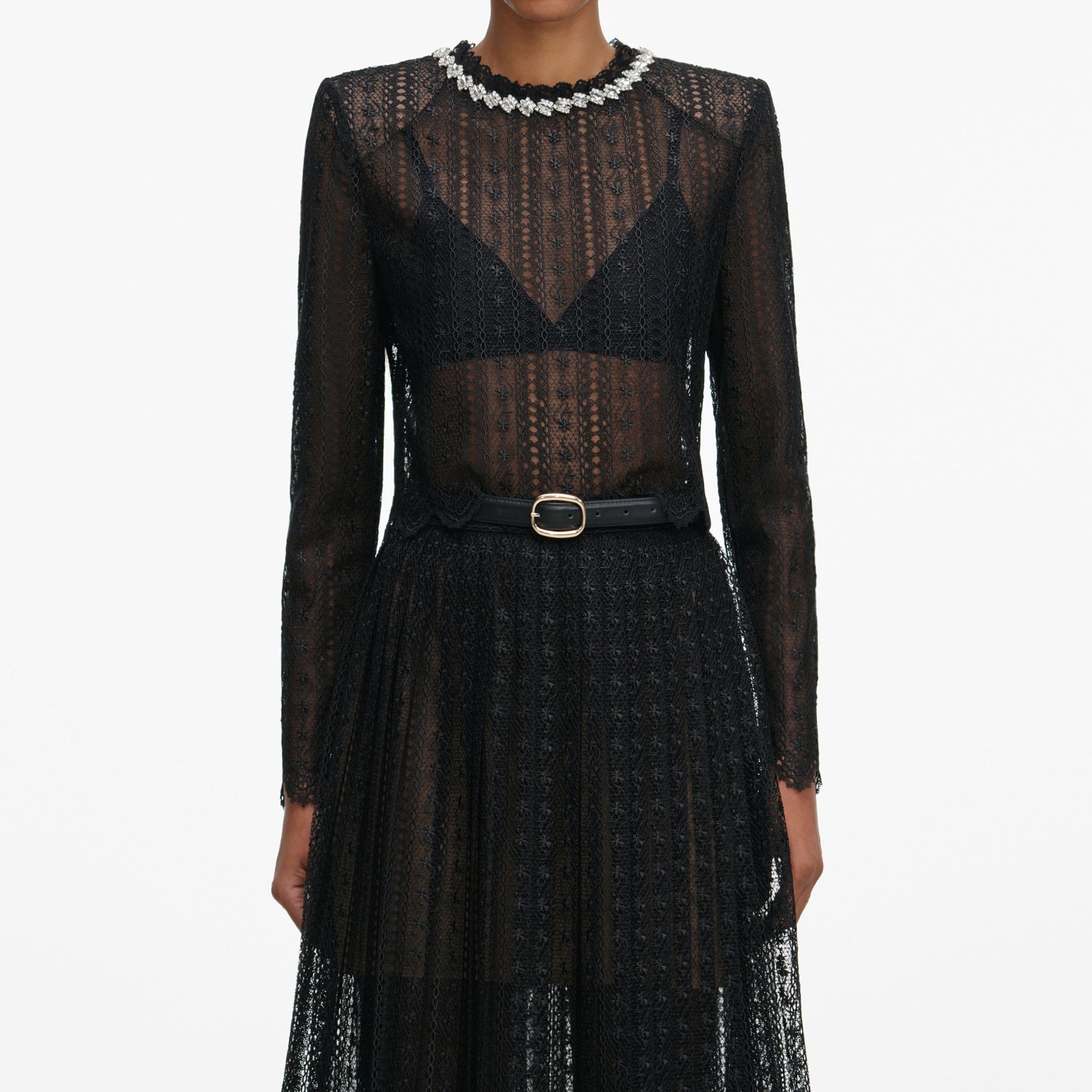 A close up of a woman wearing the Black Organza Lace Midi Skirt