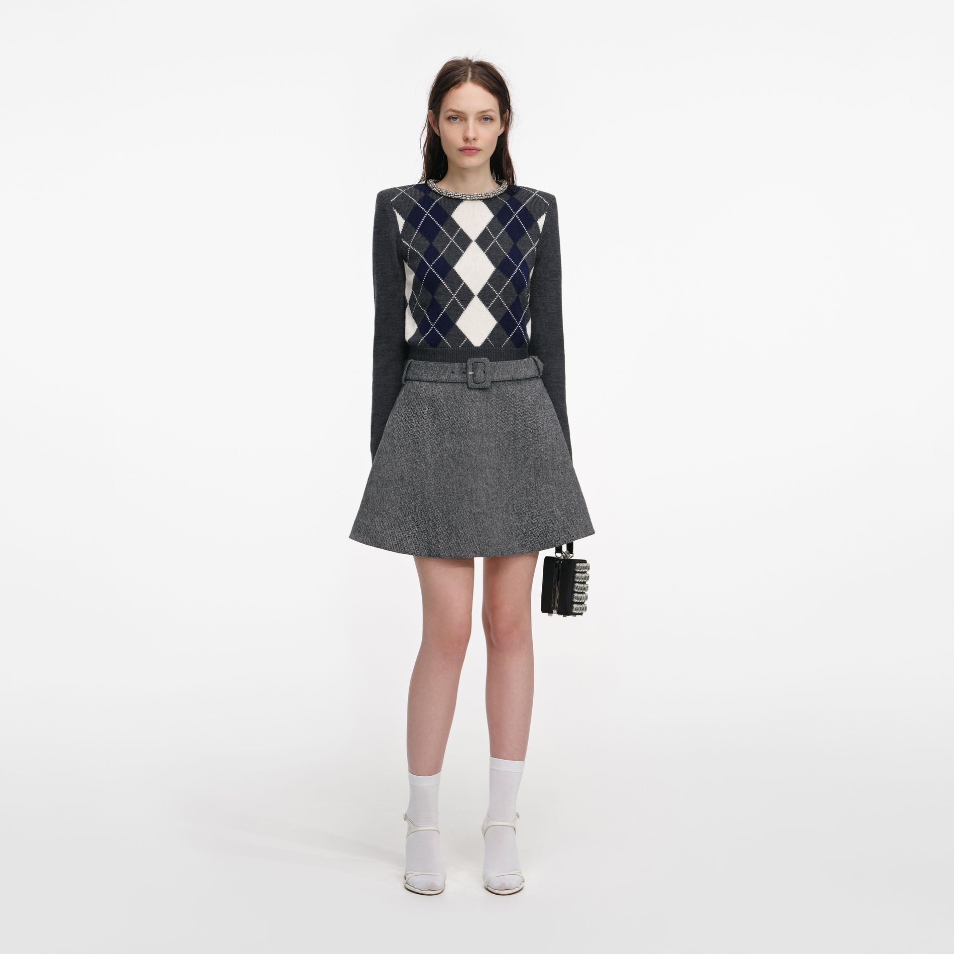 Front view of a woman wearing the Grey Argyle Crystal Trim Jumper