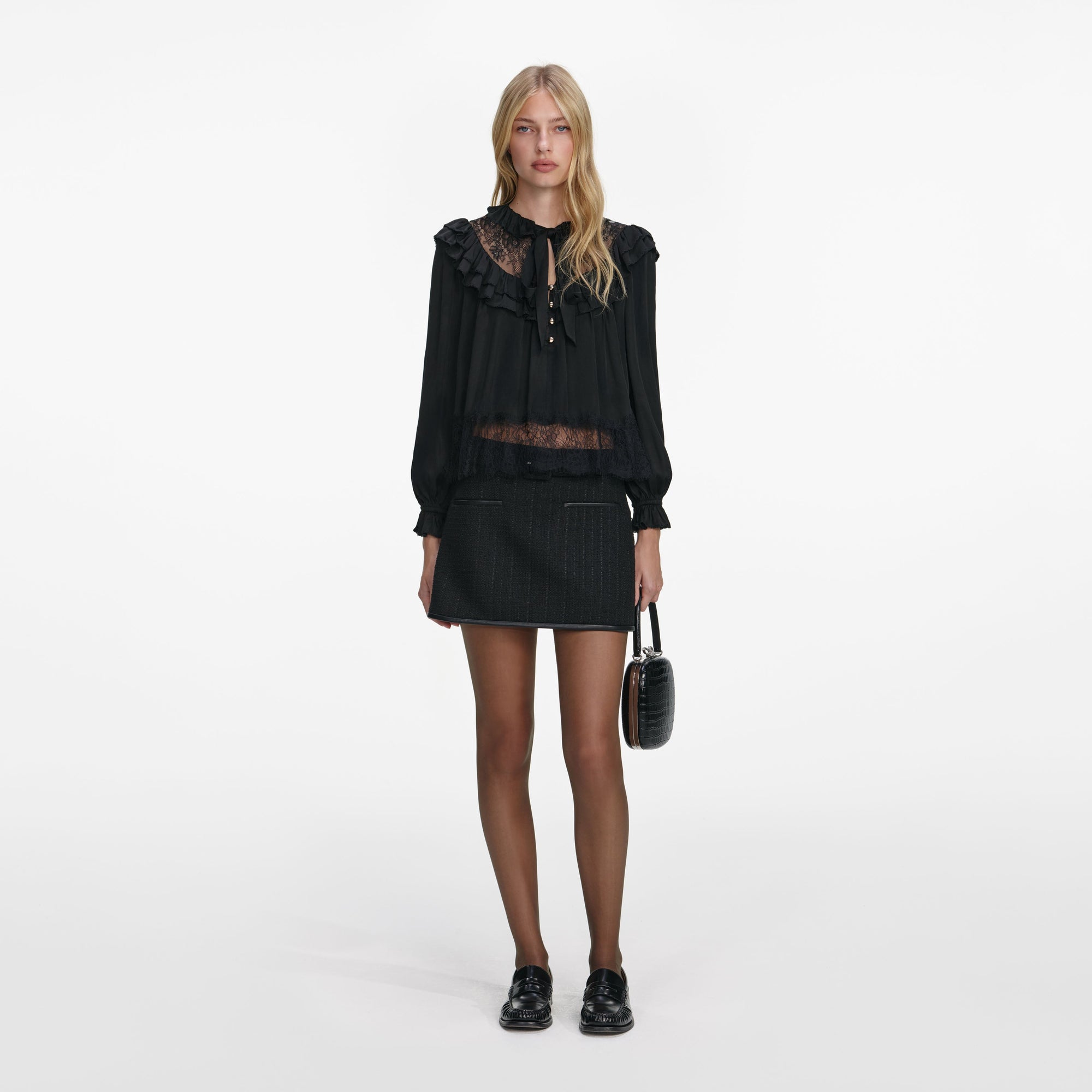 Front view of a woman wearing the Black Viscose Lace Blouse