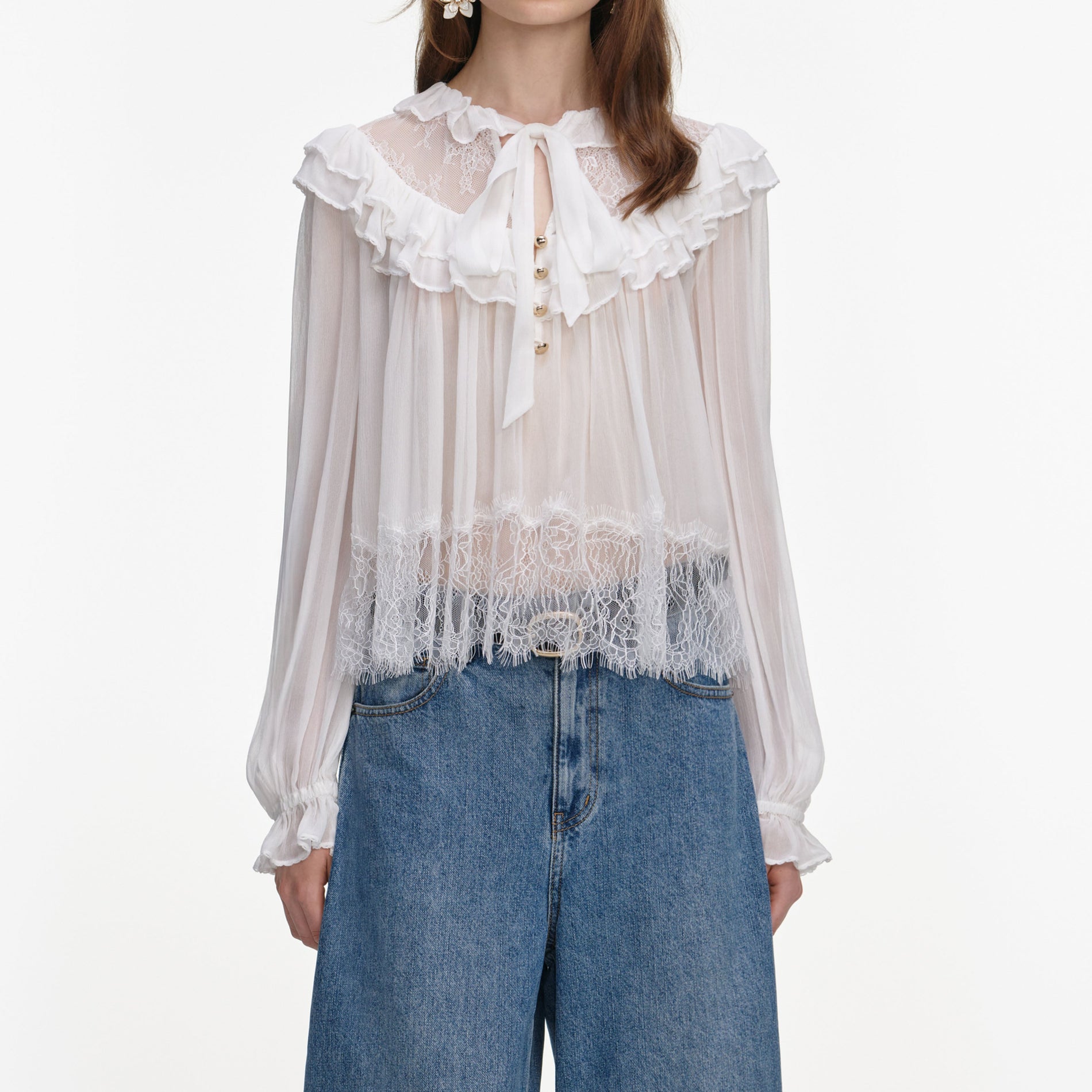 A close up of a woman wearing the White Georgette Lace Blouse