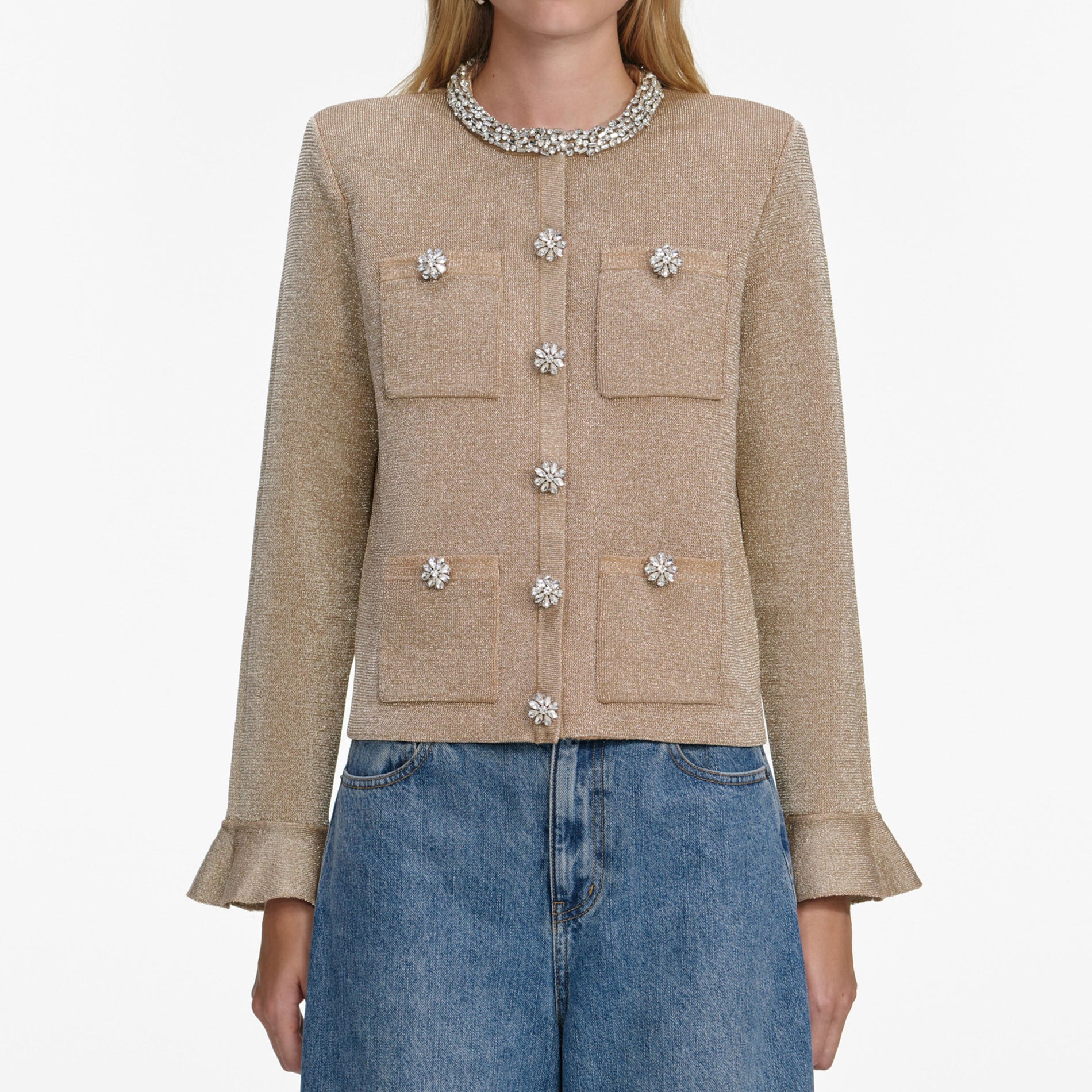 A close up of a woman wearing the Gold Crystal Trim Cardigan