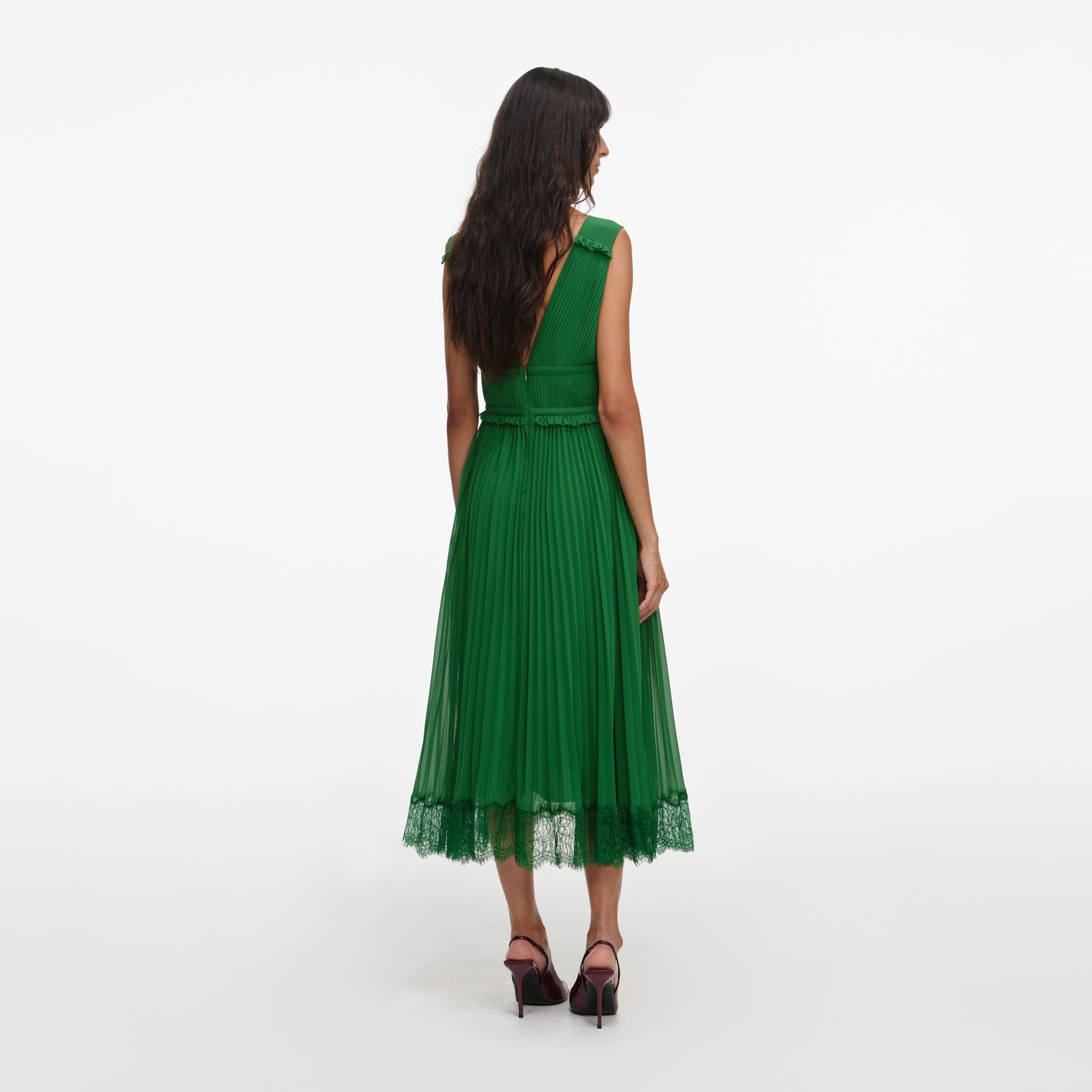 Back view of a woman wearing the Green Chiffon Midi Dress