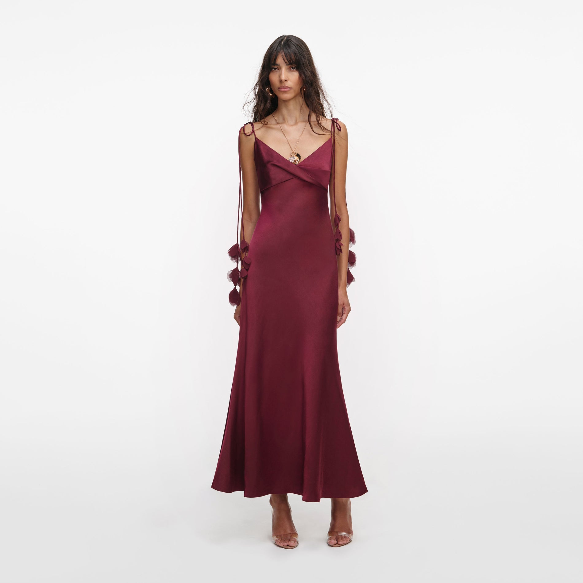 Front view of a woman wearing the Burgundy Satin Flower Midi Dress