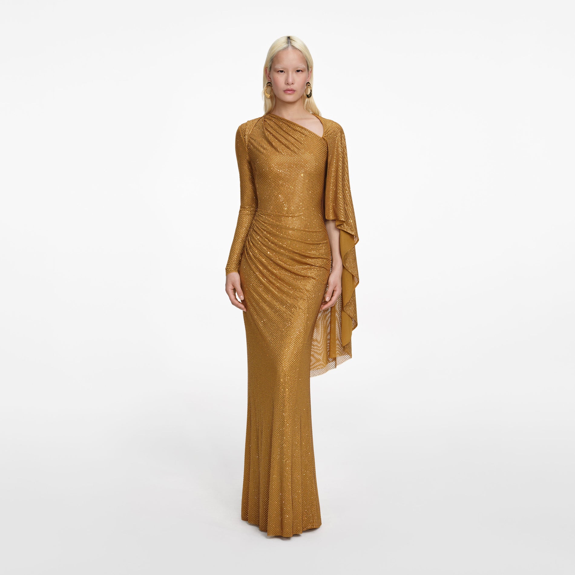 Front view of a woman wearing the Gold Rhinestone Drape Maxi Dress