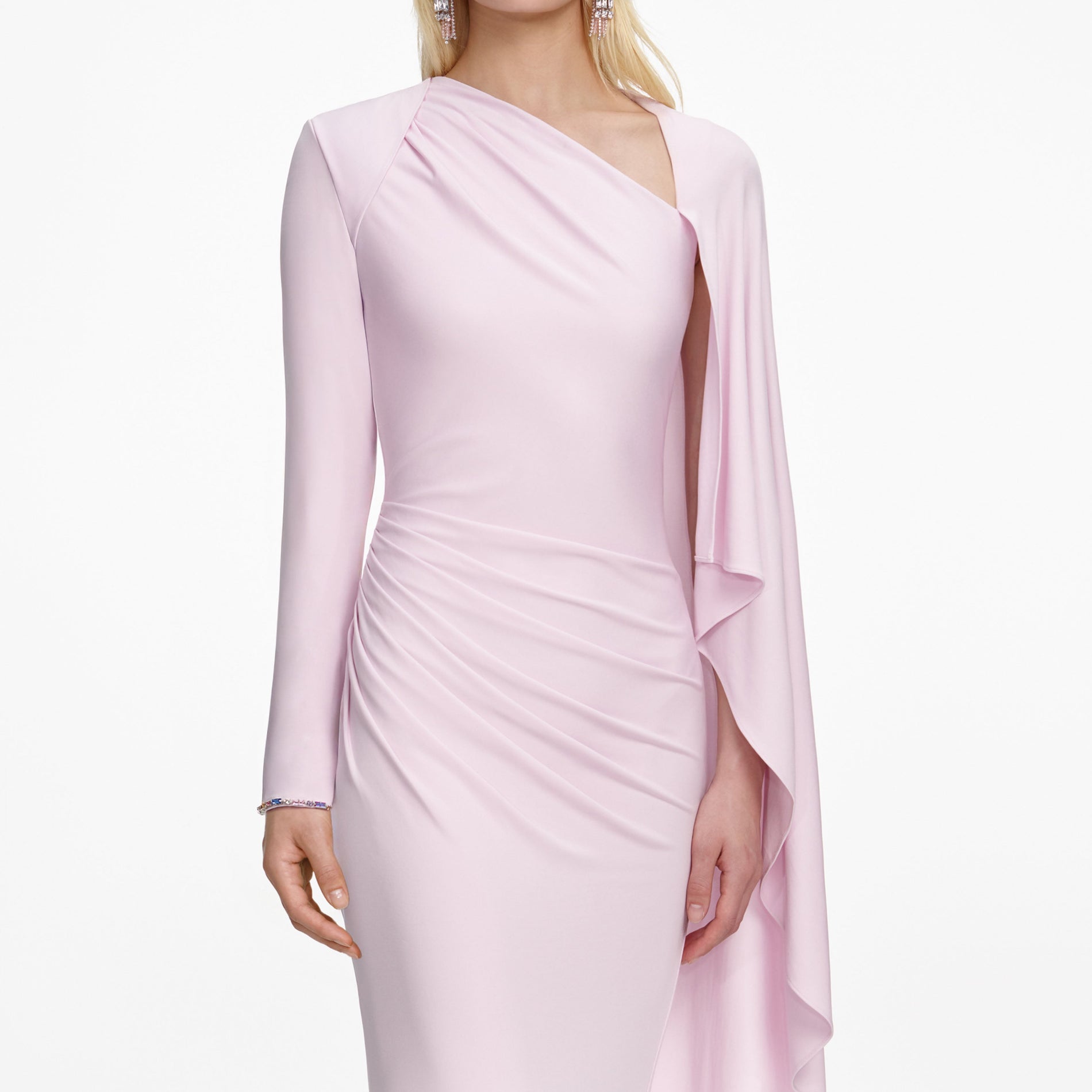A close up of a woman wearing the Pink Jersey Drape Maxi Dress