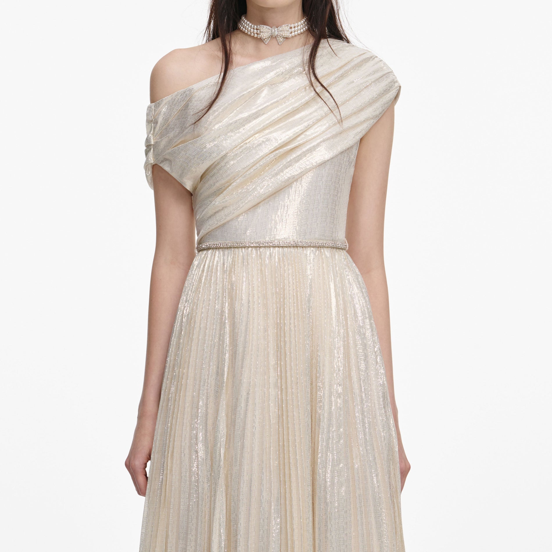 A close up of a woman wearing the Champagne Metallic Chiffon Maxi Dress