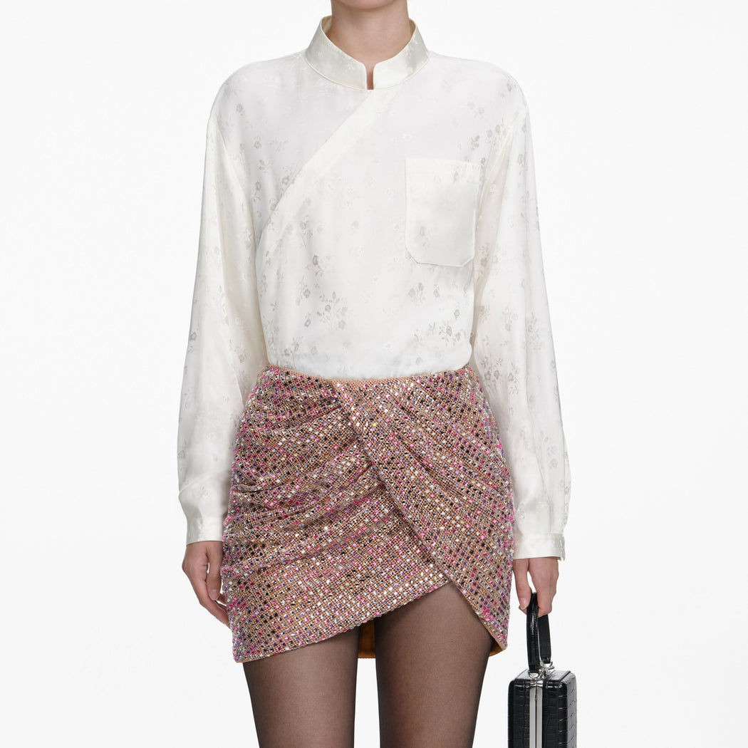 A close up of a woman wearing the Multi Rhinestone Fishnet Mini Skirt