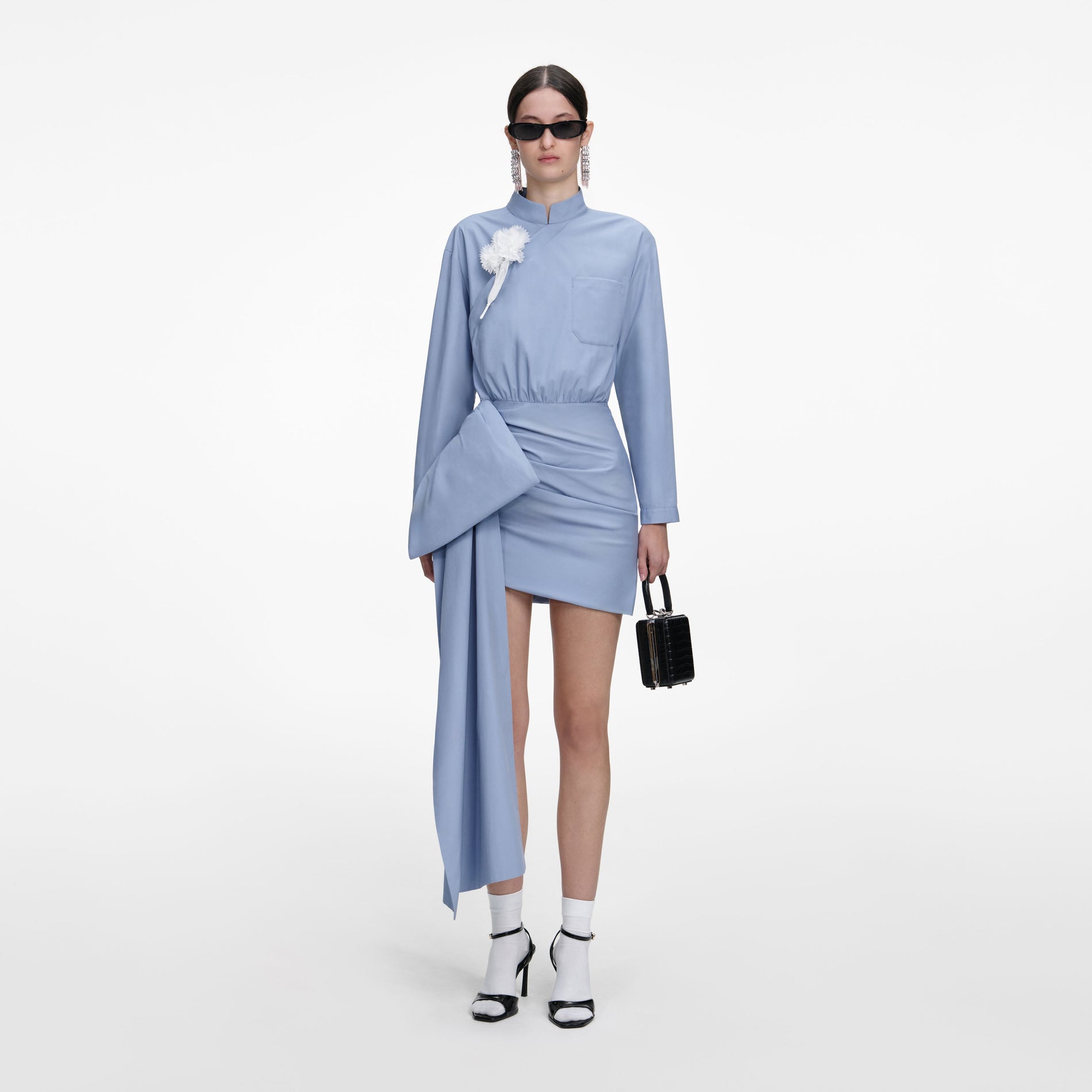 Front view of a woman wearing the Blue Cotton Tie Side Mini Dress