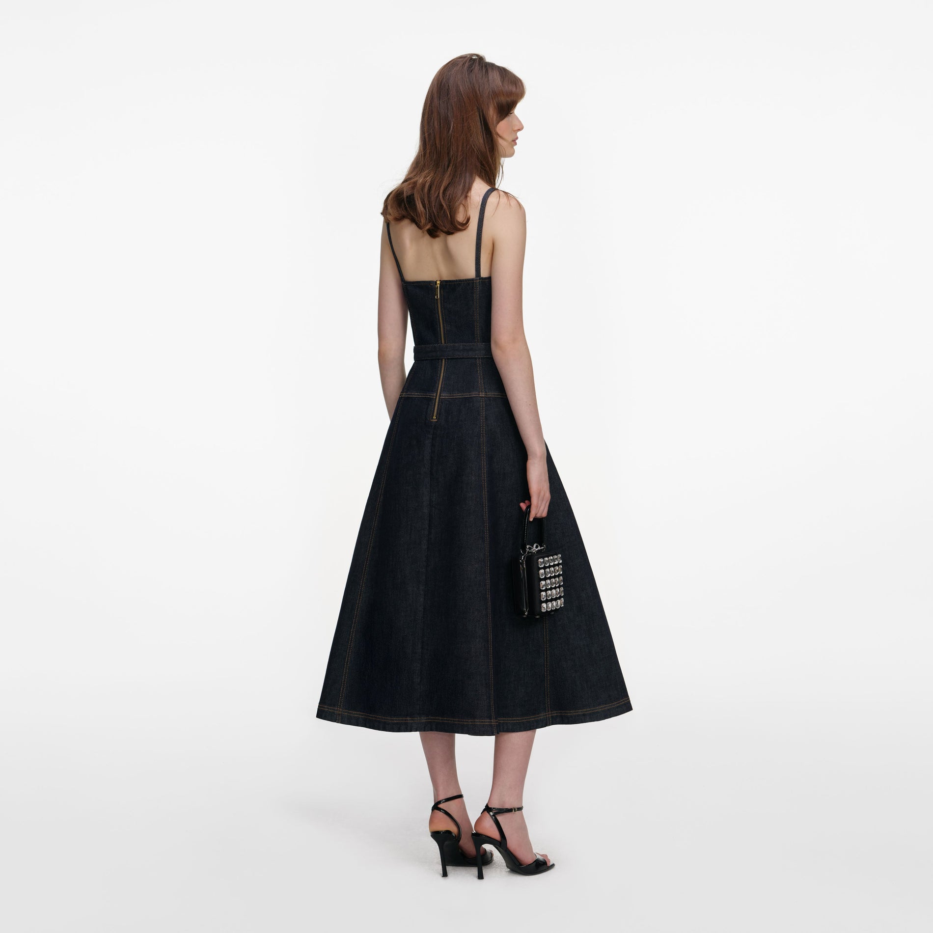 Back view of a woman wearing the Indigo Denim Flared Midi Dress