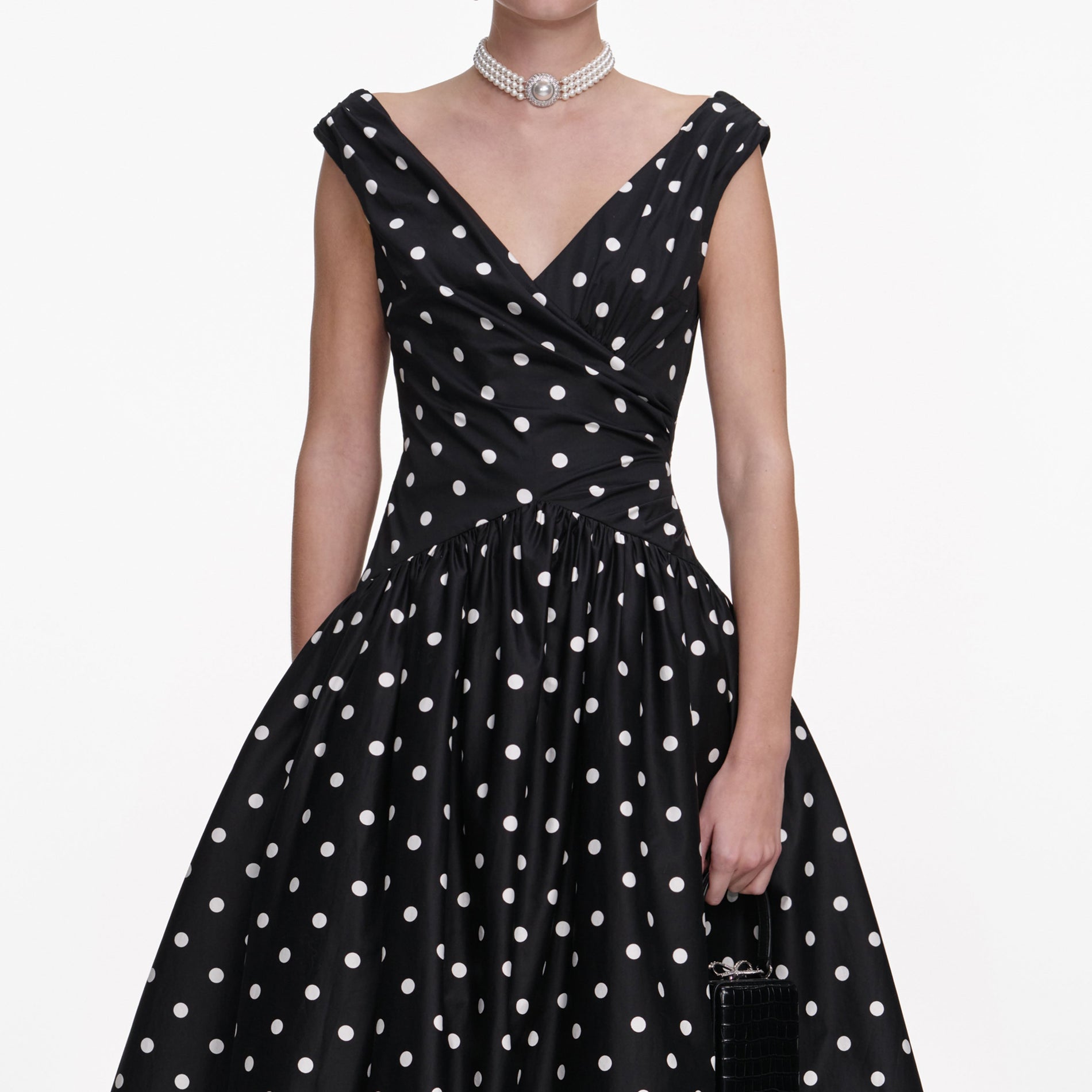 A close up of a woman wearing the Black Cotton Midi Dress