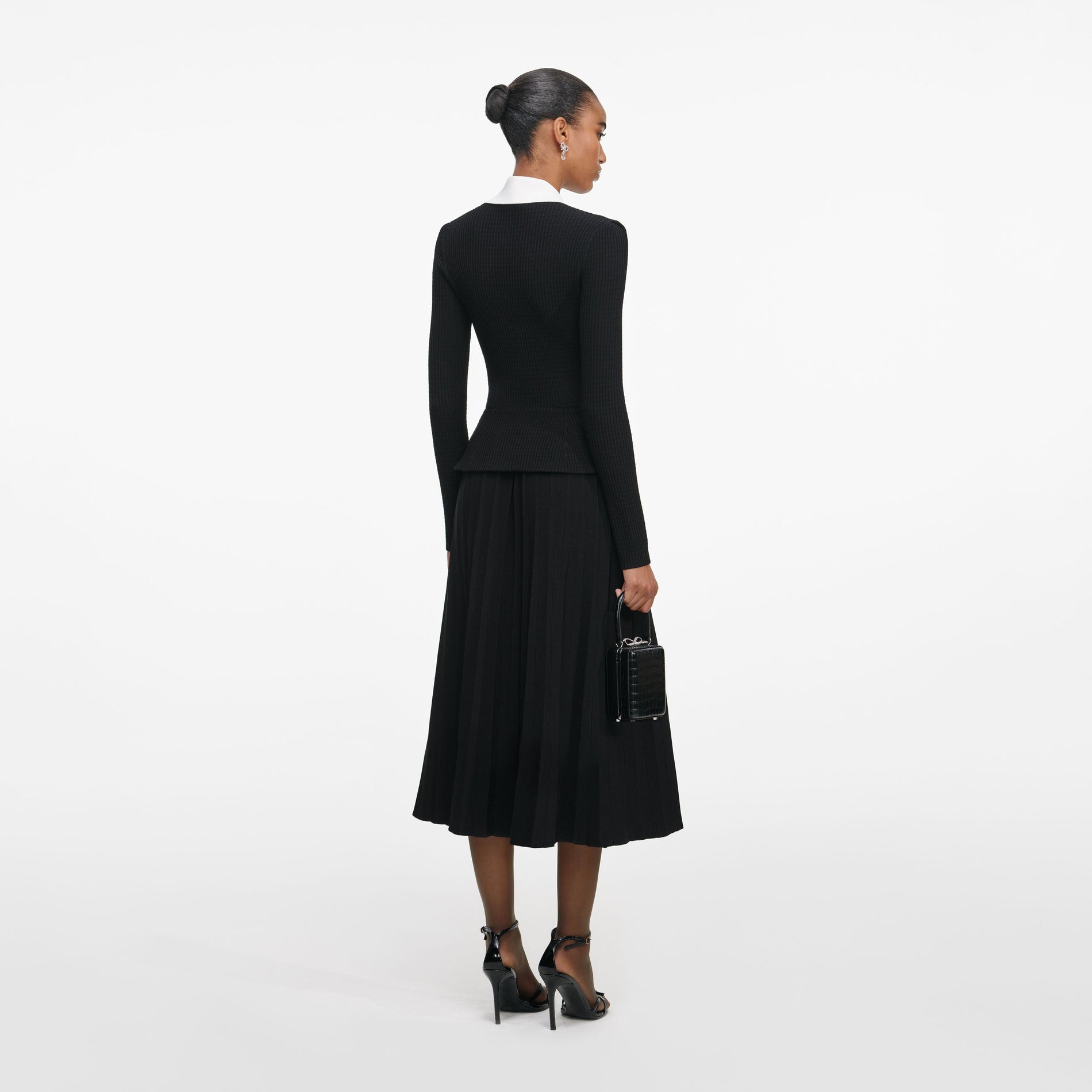 Back view of a woman wearing the Black Tailored Knit Midi Dress