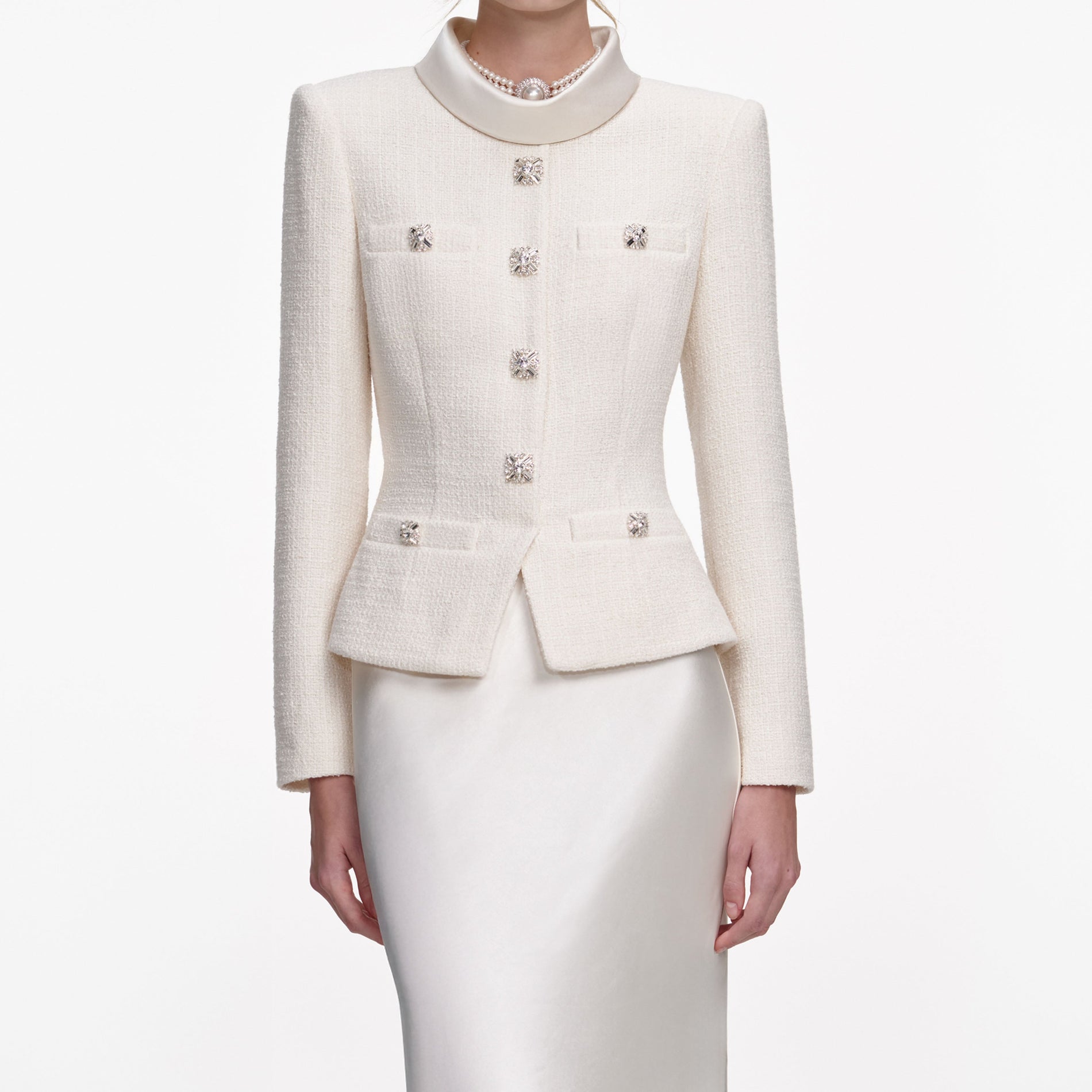 A close up of a woman wearing the Cream Boucle Collared Maxi Dress