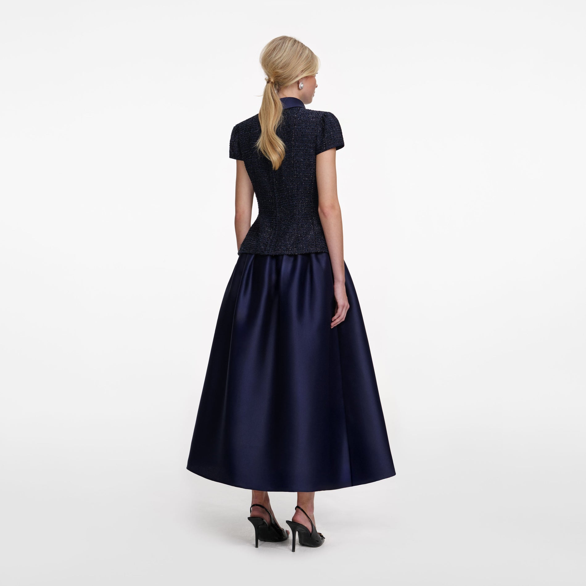 Back view of a woman wearing the Navy Metallic Boucle Taffeta Midi Dress