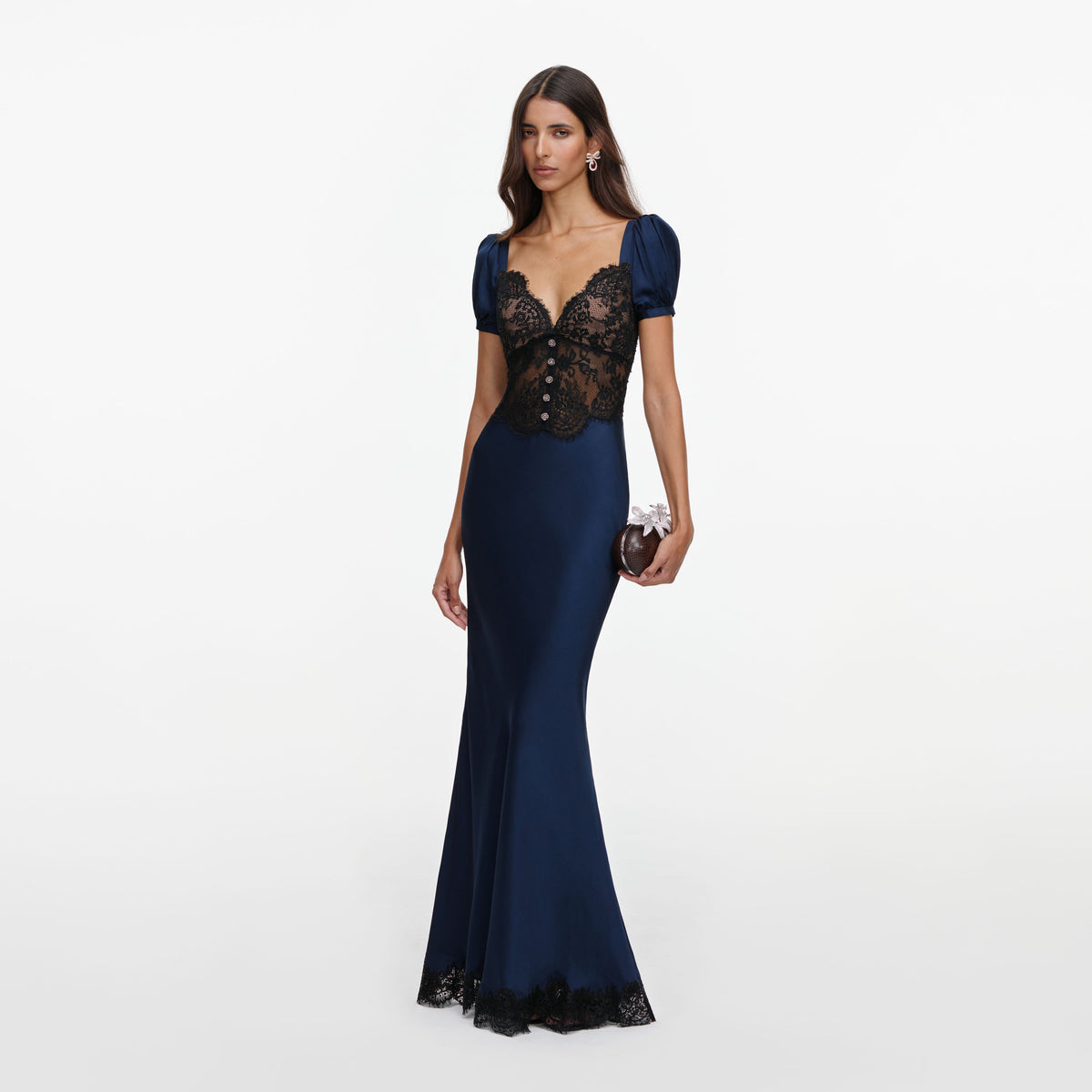 Side view of a woman wearing the Navy Viscose Lace Maxi Dress