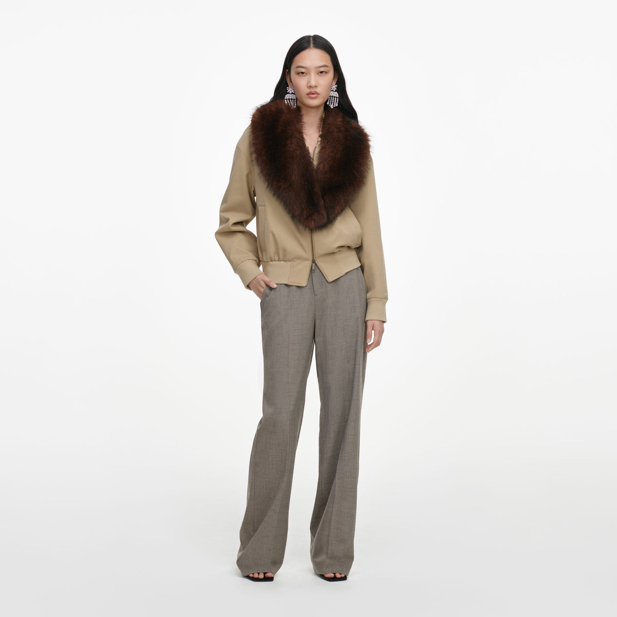 Front view of a woman wearing the Beige Faux Fur Bomber Jacket