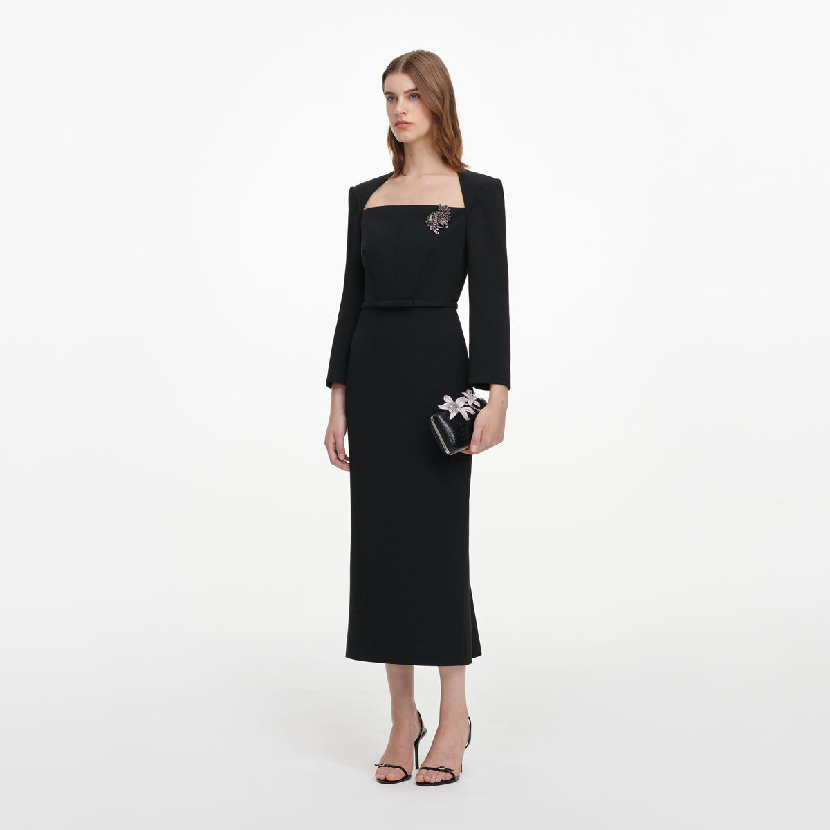 Side view of a woman wearing the Black Tailored Brooch Midi Dress