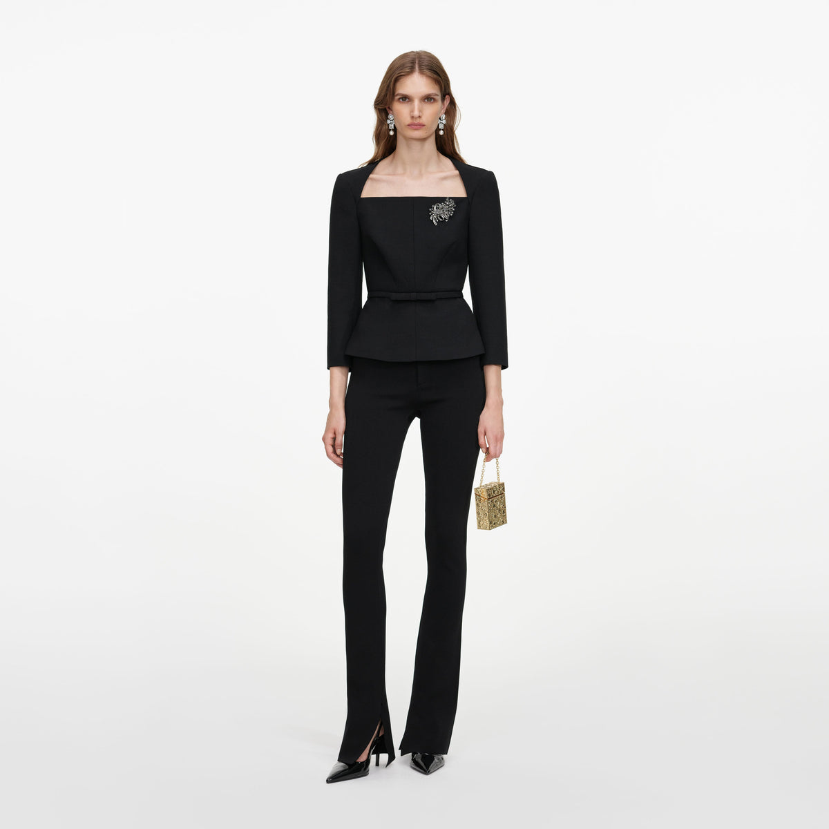 Front view of a woman wearing the Black Tailored Brooch Top