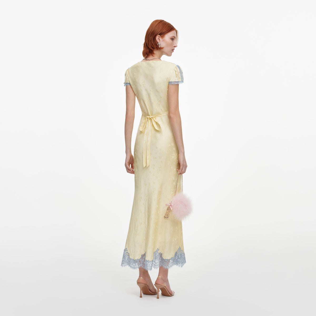 Back view of a woman wearing the Yellow Viscose Lace Midi Dress