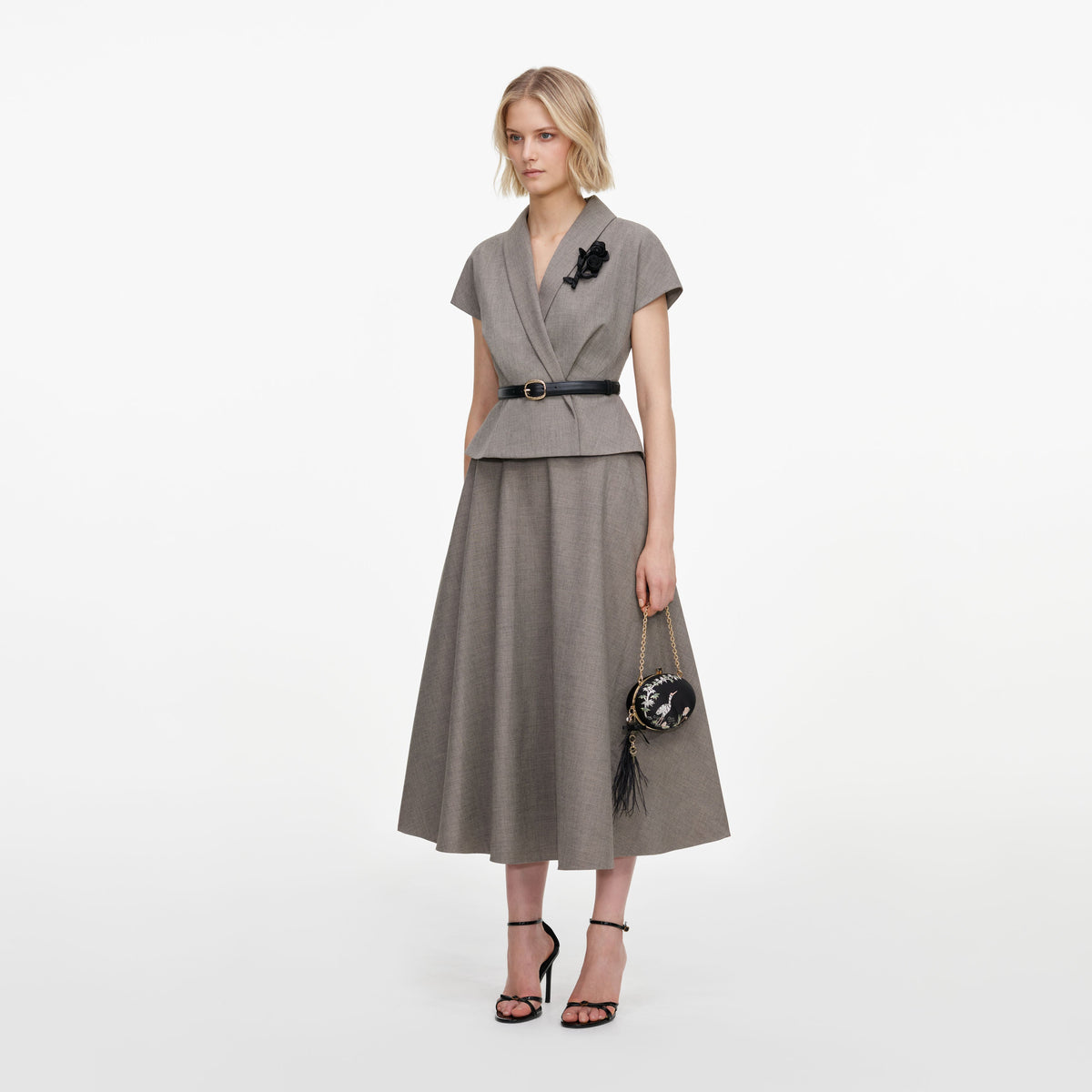 Side view of a woman wearing the Brown Twill Brooch Midi Dress