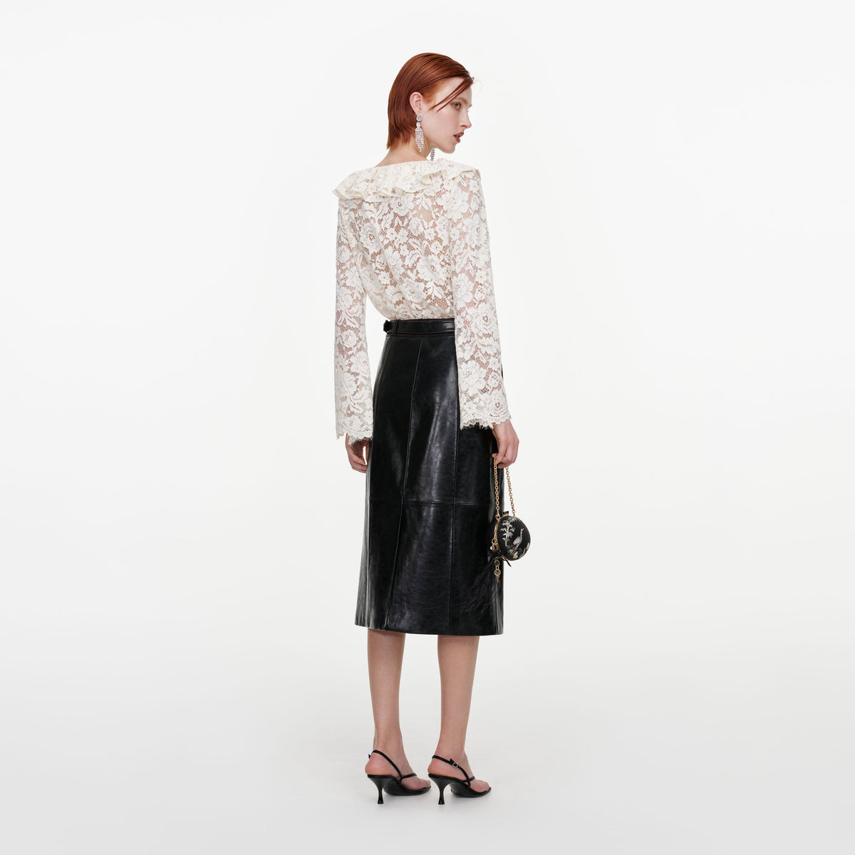 Back view of a woman wearing the Cream Lace Frill Top