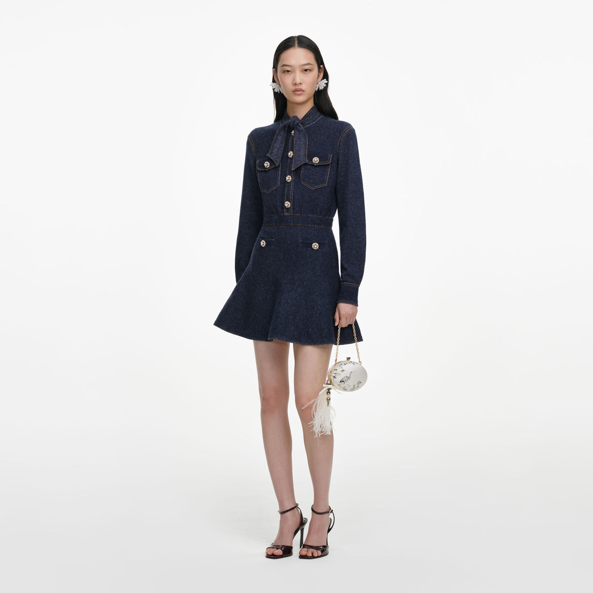 Side view of a woman wearing the Navy Textured Knit Mini Dress