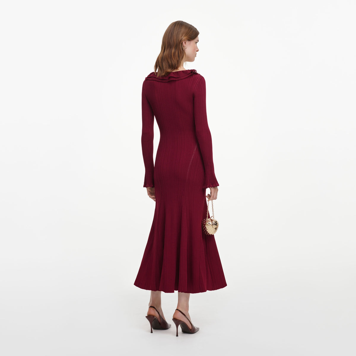 Back view of a woman wearing the Burgundy Ruffle Knit Midi Dress