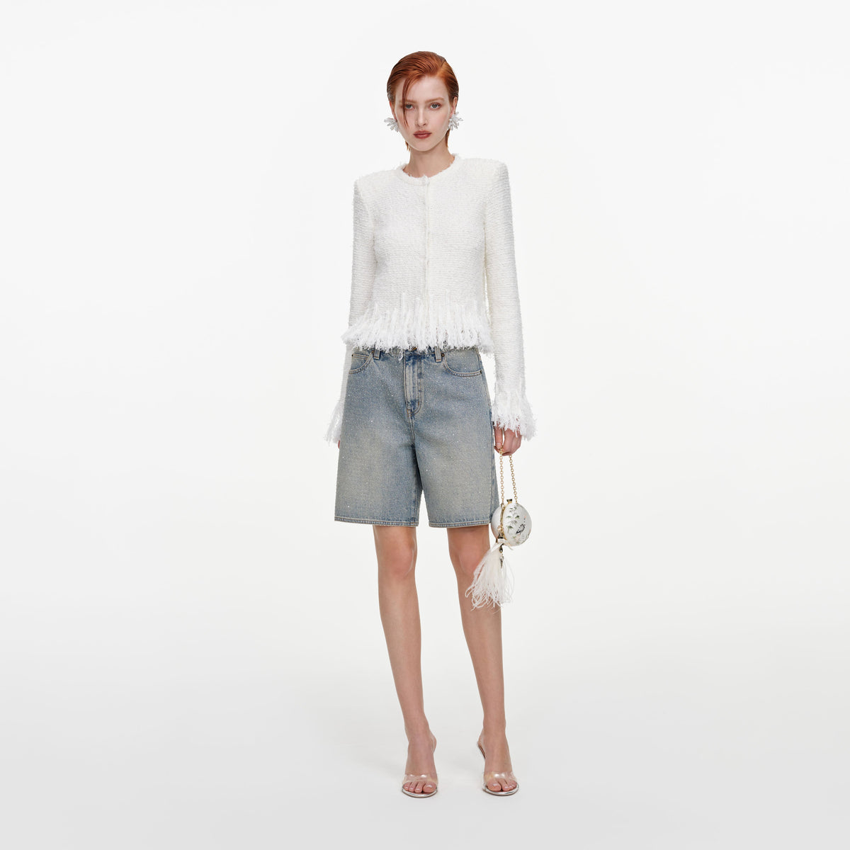 Front view of a woman wearing the White Fringe Knit Cardigan