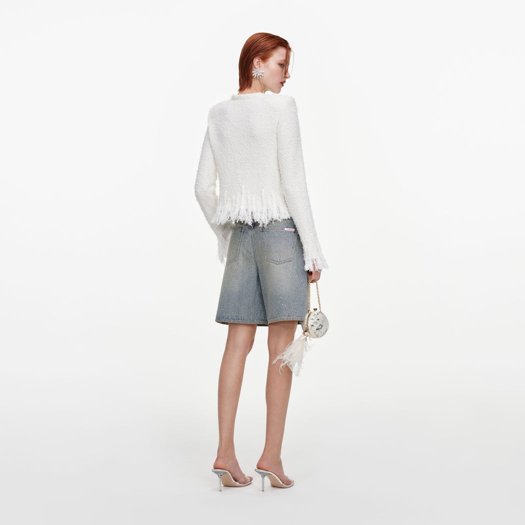 Back view of a woman wearing the White Fringe Knit Cardigan