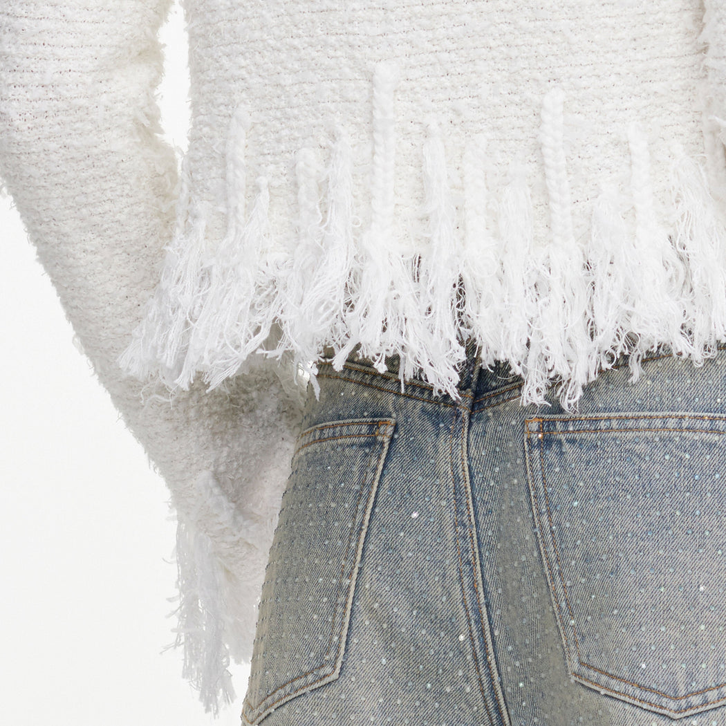 A close up of the fabric for the White Fringe Knit Cardigan
