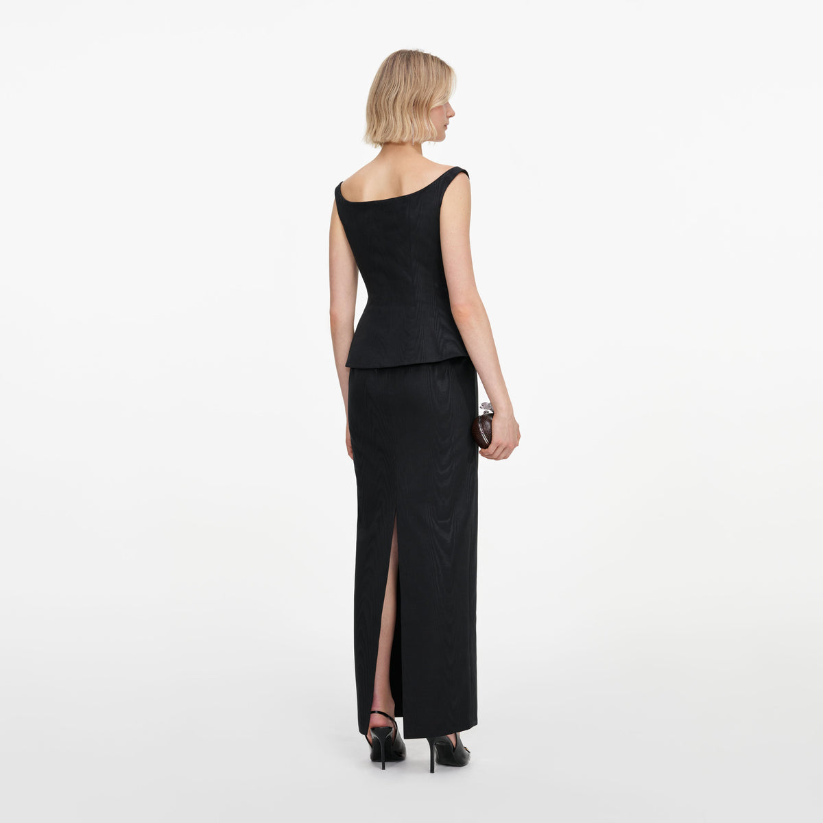 Back view of a woman wearing the Black Structured Bardot Maxi Dress