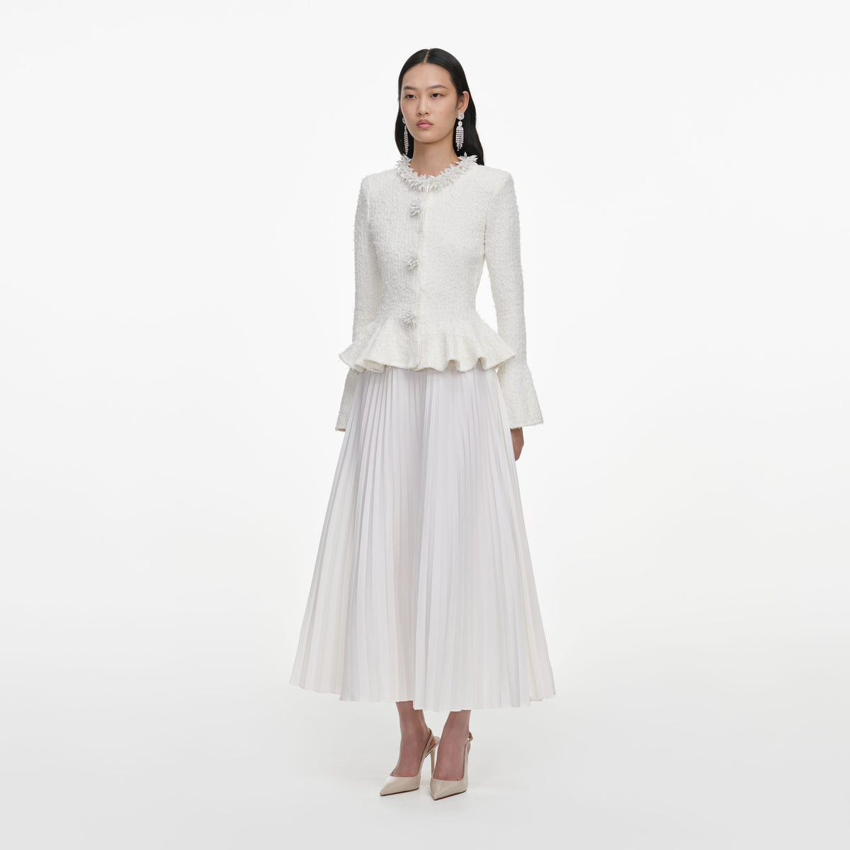 Side view of a woman wearing the White Textured Knit Chiffon Midi Dress