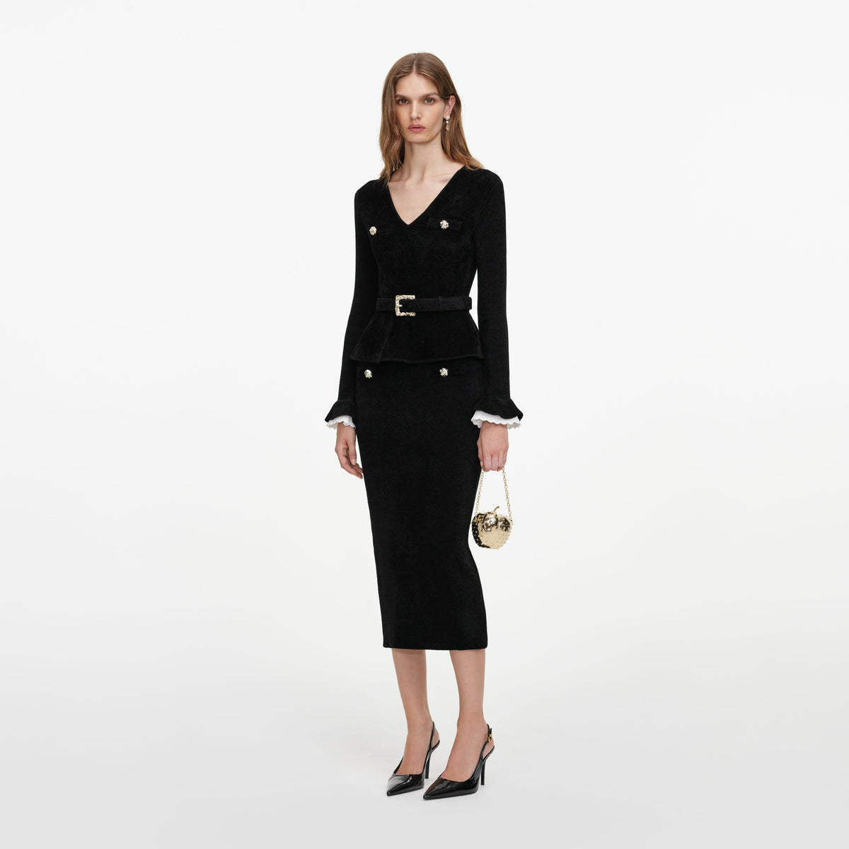 Side view of a woman wearing the Black Chenille Peplum Knit Midi Dress