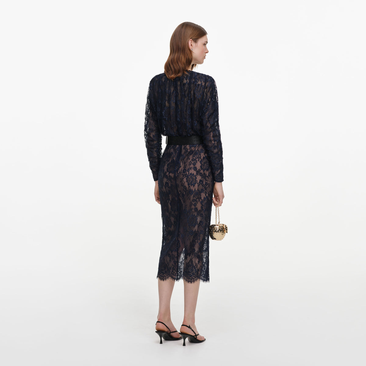 Back view of a woman wearing the Navy Lace Button Midi Dress