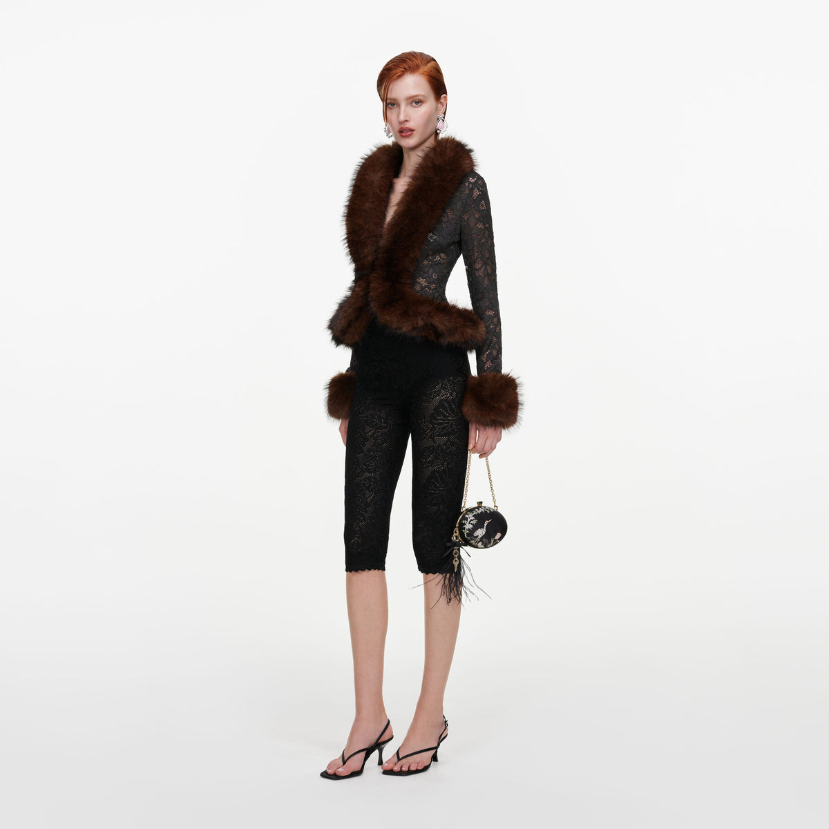 Side view of a woman wearing the Grey Lace Fur Collar Top