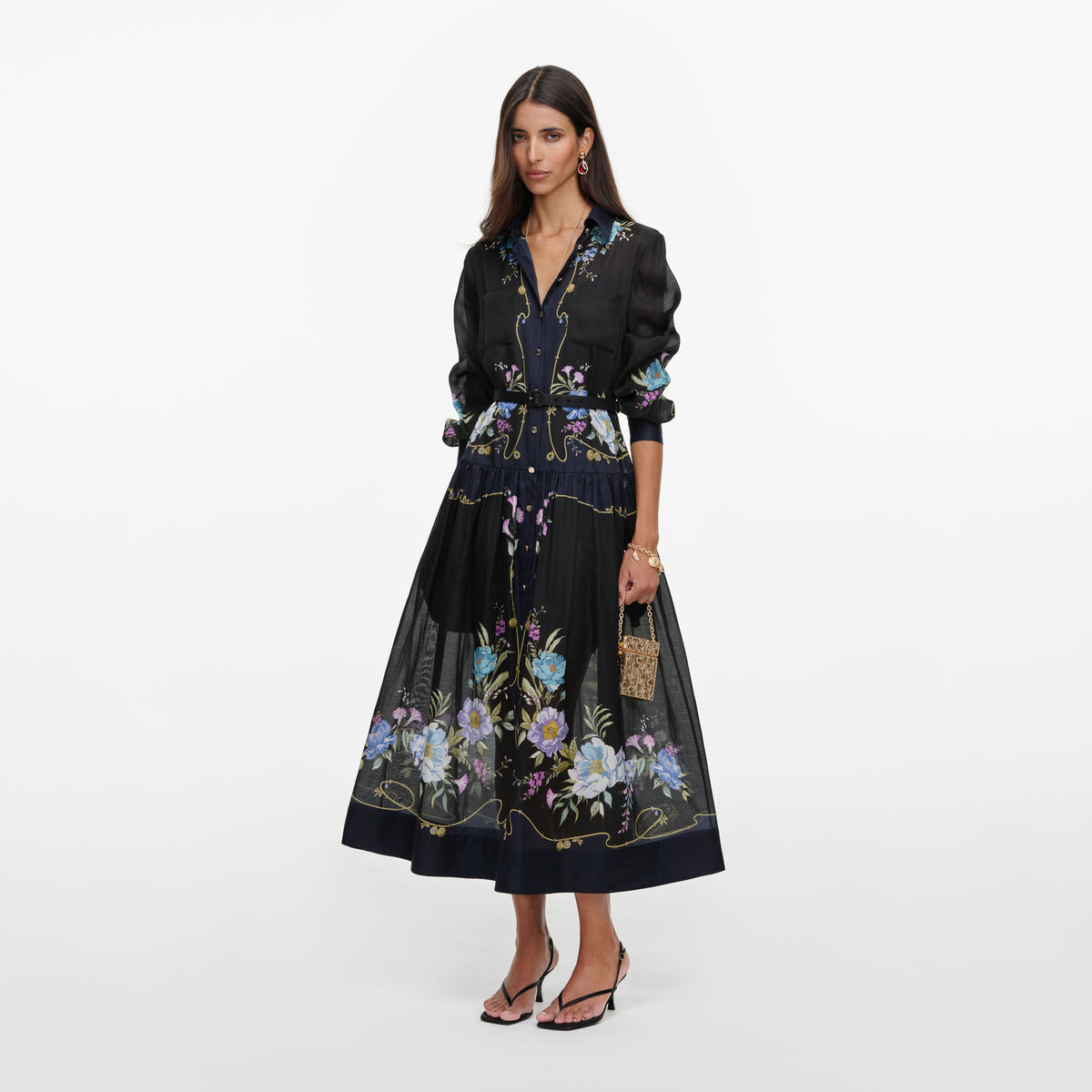 Side view of a woman wearing the Navy Floral Organza Midi Dress