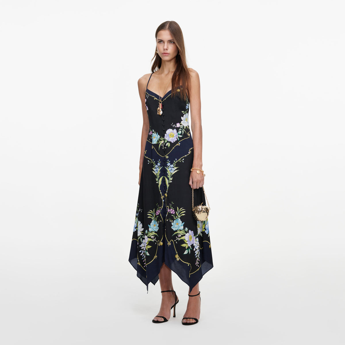 Side view of a woman wearing the Navy Floral Midi Dress