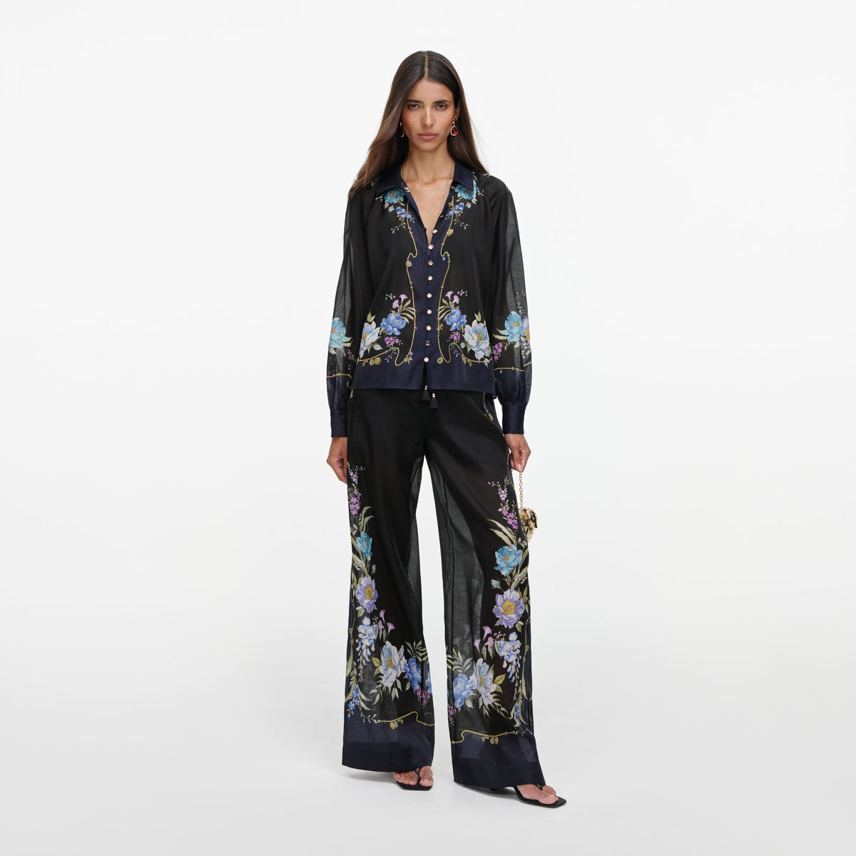 Front view of a woman wearing the Navy Floral Organza Trousers