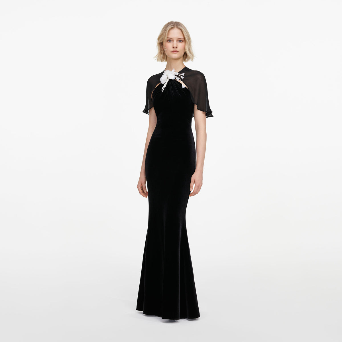 Side view of a woman wearing the Black Velvet Cape Maxi Dress