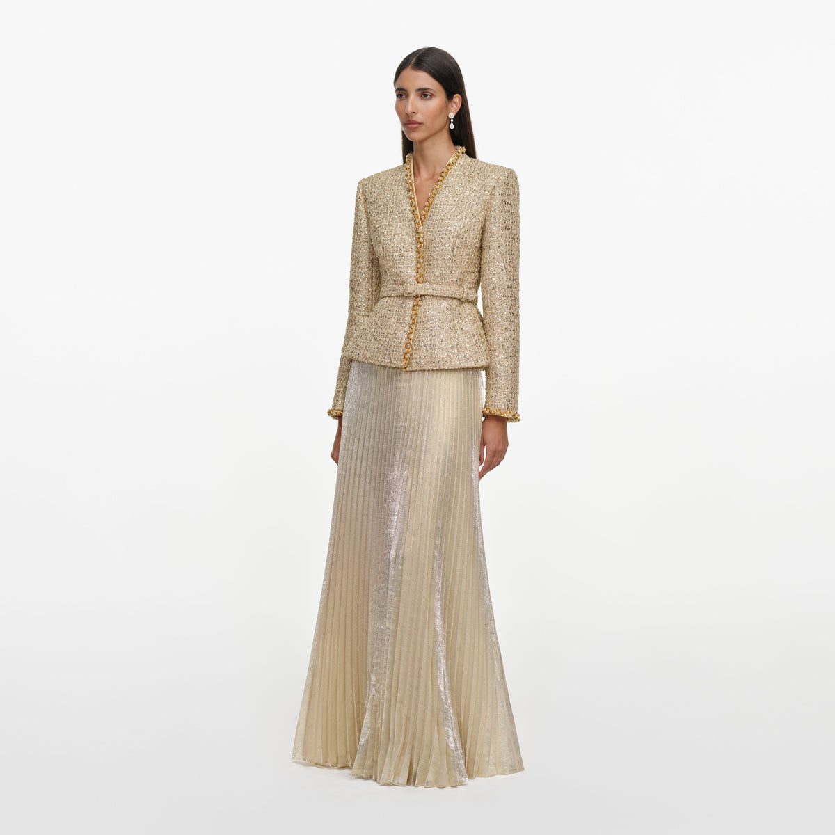 Side view of a woman wearing the Gold Boucle Pleated Maxi Dress