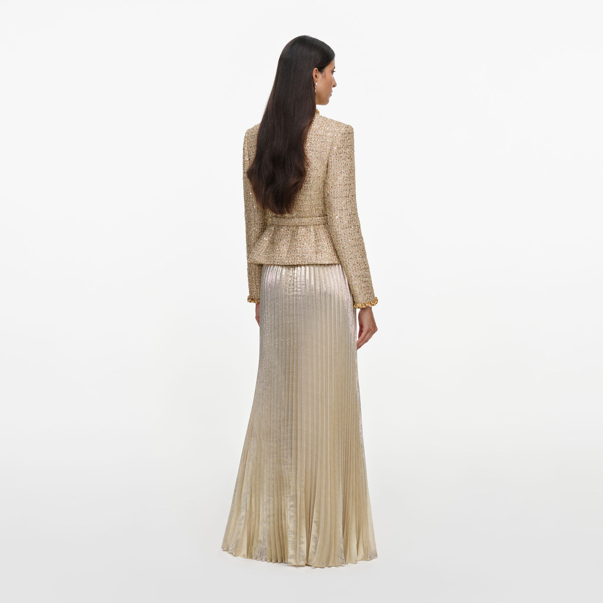 Back view of a woman wearing the Gold Boucle Pleated Maxi Dress