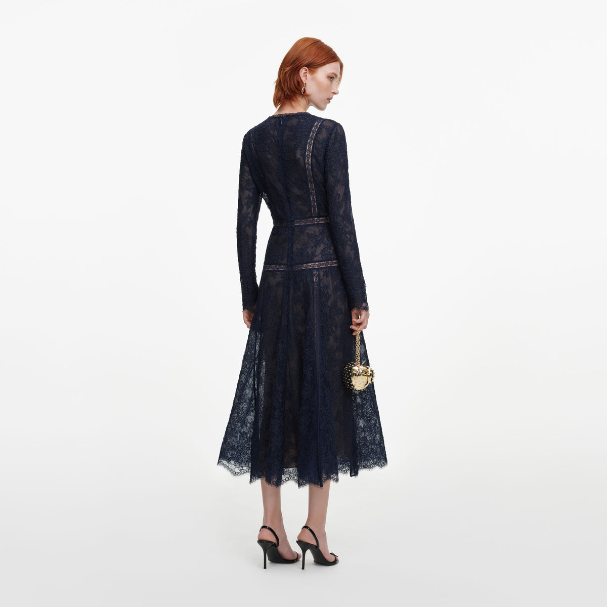 Back view of a woman wearing the Navy Lace Midi Dress