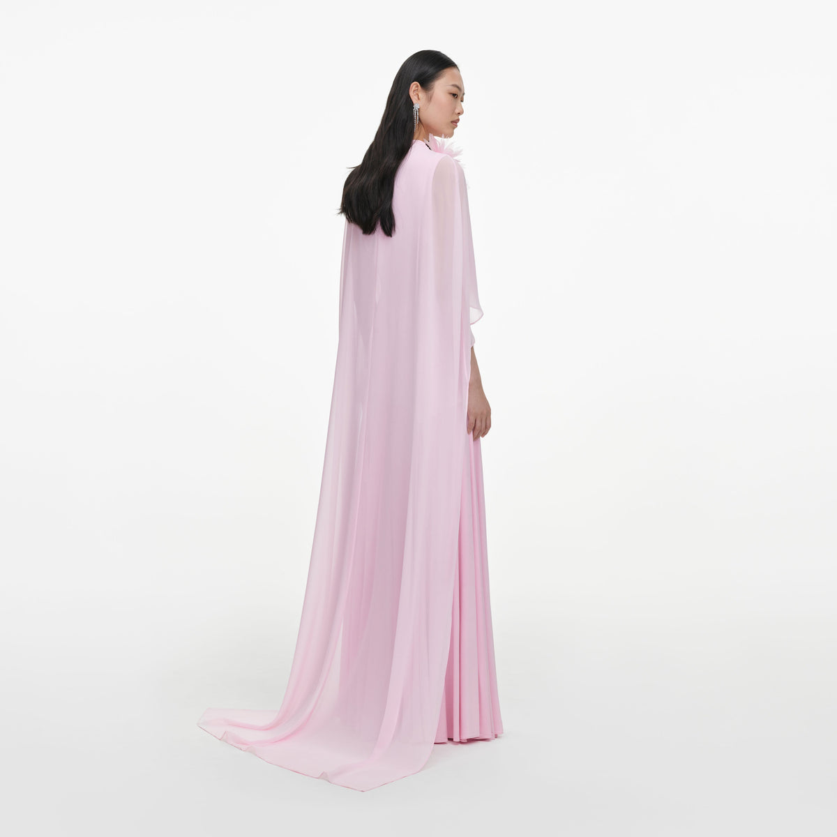 Back view of a woman wearing the Pink Satin Jersey Cape Maxi Dress