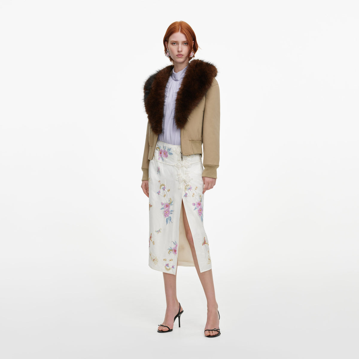 Side view of a woman wearing the Cream Jacquard Floral Midi Skirt