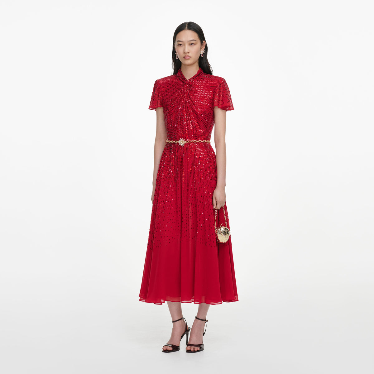 Side view of a woman wearing the Red Ombre Rhinestone Twist Midi Dress