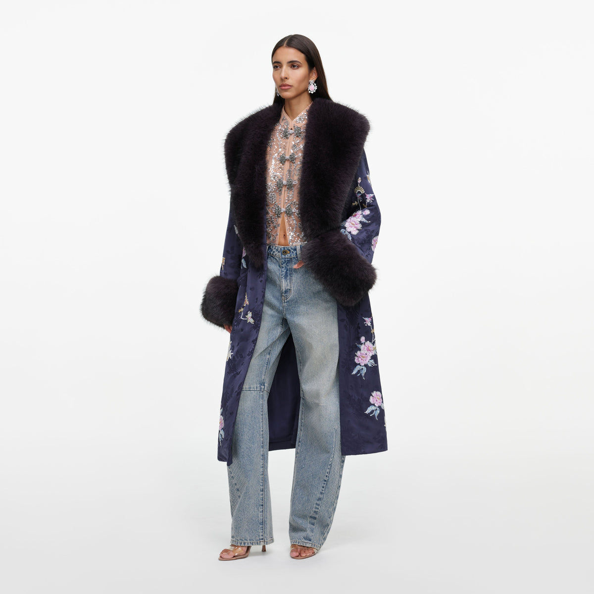 Side view of a woman wearing the Navy Floral Jacquard Fur Collar Coat