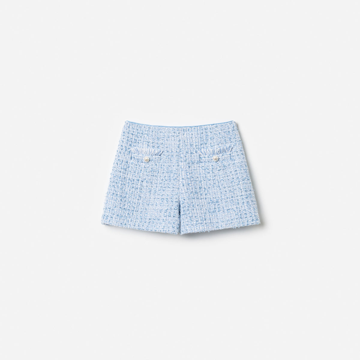 Front view of a girl wearing the Blue Textured Boucle Shorts
